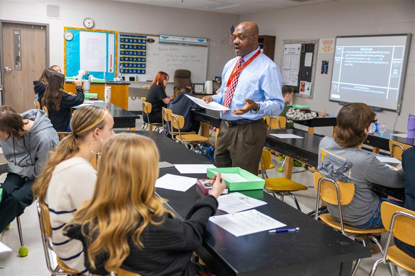 Students study rocks in a science lab